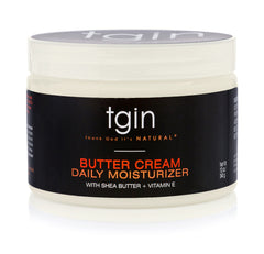 tgin Butter Cream Daily Moisturizer being applied to dry curly hair for softness.