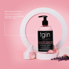 tgin Rose Water conditioner being applied to curls for easy detangling.