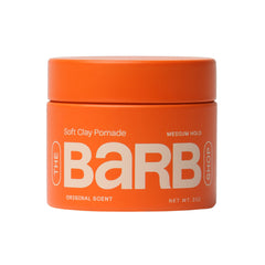 The Barb Shop Barb Soft Clay Pomade jar offers medium hold for flexible daily styling.