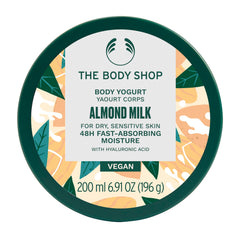 The Body Shop Almond Milk Body Yogurt jar close-up shows creamy gel-cream texture for fast absorption.