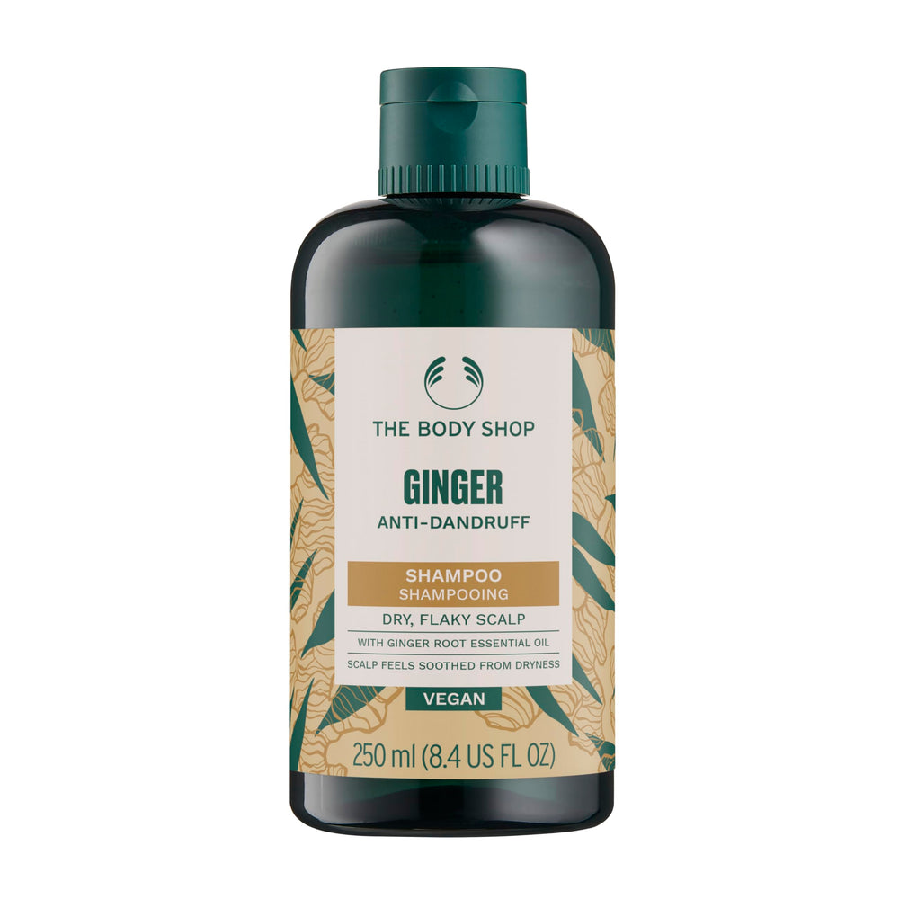 The Body Shop Ginger Scalp Care Shampoo pour bottle shows a refreshing cleanse for dry scalp relief.
