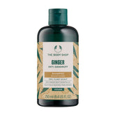 The Body Shop Ginger Scalp Care Shampoo pour bottle shows a refreshing cleanse for dry scalp relief.
