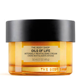 The Body Shop Oils of Life cream jar closeup shows nourishing texture for revitalized skin.