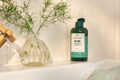 The Body Shop Tea Tree Toner on cotton pad for makeup removal and pore refining