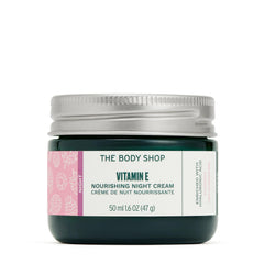 The Body Shop Vitamin E Night Cream jar closeup showing rich texture for overnight hydration.