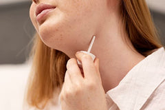 The Body Shop White Musk Perfume Oil application on wrist highlights gentle, alcohol-free wear.