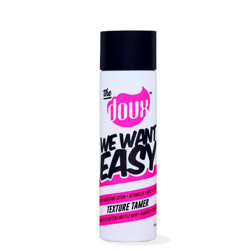 The Doux WE WANT EASY leave-in bottle pours to detangle curls with moisture.