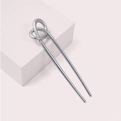 The Hair Edit knotted chignon pin in use demonstrates chic minimal design for versatile styling