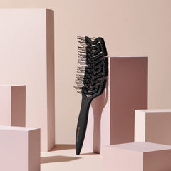 The Hair Edit non-slip grip handle keeps brushes secure in wet showers.