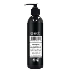 The Henna Guys bottle on bathroom counter with open cap ready for quick pre-shave