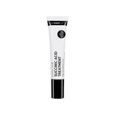 The INKEY List Succinic Acid Treatment bottle close-up showing targeted blemish care and oil reduction.