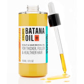 The-Mix-Up Golden Batana Oil bottle highlights premium packaging for hair nourishment.