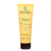 The Naked Bee Gentle Shampoo bottle pours orange blossom honey for gentle cleansing.