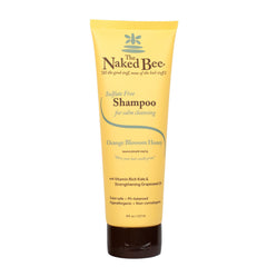 The Naked Bee Gentle Shampoo bottle pours orange blossom honey for gentle cleansing.
