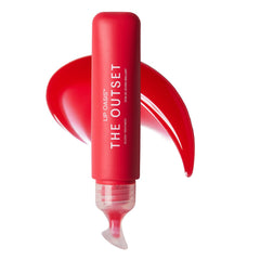 The Outset Lip Oasis Glossy Treatment pour demonstrates smooth application and hydration.
