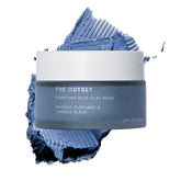 The Outset Purifying Blue Clay Mask jar closeup highlights fragrance-free detox for pores.
