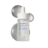 The Outset Ultralight Moisture Oil bottle closeup highlighting fast-absorbing hydration.