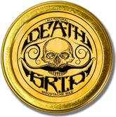 THE VINTAGE GROOMING CO. Death Grip jar close-up shows extra-strong hold for all-day shaping.