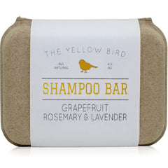 The Yellow Bird solid bar shampoo closeup shows grapefruit, rosemary and lavender aroma.