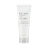 The Face Shop bottle close-up of White Seed Exfoliating Cleansing Foam highlighting gentle cleansing.