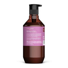 Theorie Helichrysum & Plum conditioner pump close-up for easy, mess-free application.