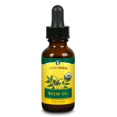 TheraNeem Naturals Neem Oil bottle is a pure organic oil for skin and hair care.