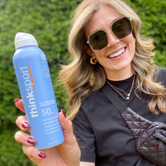 Thinksport SPF 50+ mineral spray close-up showing clear, sheer coverage