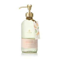 Thymes Hand Wash Mandarin Coriander bottle highlights refreshing herbal-citrus cleanse for daily use.