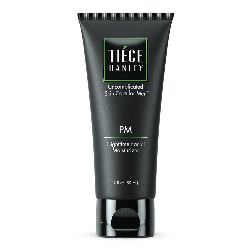 Tiege Hanley face moisturizer bottle close-up for nighttime hydration and skin nourishment.