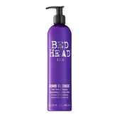 TIGI Bed Head Dumb Blonde purple-toning shampoo bottle neutralizes brass for cooler blonde tones.