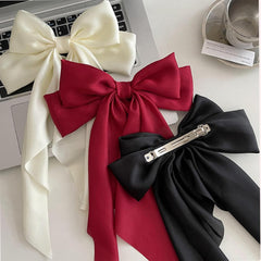 Tobeffect bow clip detail showing secure hair clasp for steady wear.