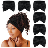 Tobeffect wide headband in black with front turban knot for secure all-day wear.