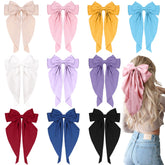 TOKUFAGU large hair bow with long tails and metal clip for secure styling.
