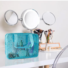 TotePrint holographic star large blue handle view emphasizes easy portability for travel.