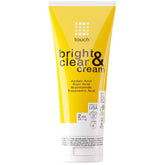 TOUCH Radiance Cream bottle closeup suggests brighter-looking skin.