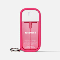 Touchland Hibiscus Pink Case clipped on a bag demonstrates hands-free access.