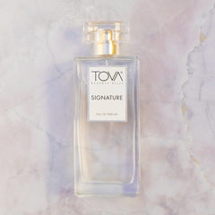 Tova Signature spray application shot demonstrates easy daily use for busy mornings and confidence