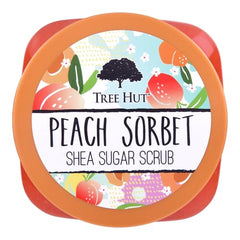 Tree Hut Peach Sorbet Scrub jar closeup reveals creamy texture ideal for exfoliation