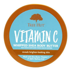 Tree Hut Vitamin C Whipped Shea Body Butter ingredient scene featuring shea butter and vitamin C