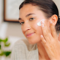 Tree of Life Beauty Moisturizer being applied to face and neck, smooth feel.