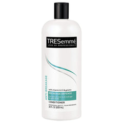 TRESemmé conditioner bottle pour showing Vitamin B12 for stronger hair instantly