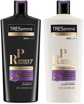 TRESemmé Repair 7 Biotin shampoo bottle pouring for smoother hair