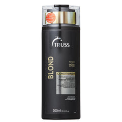TRUSS Blond Conditioner violet bottle on vanity supports color protection and hydration.