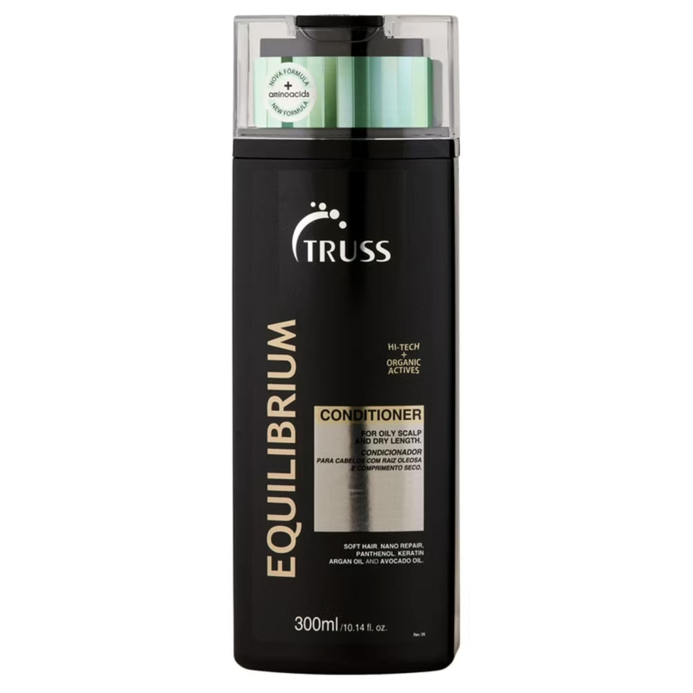 TRUSS Equilibrium conditioner bottle close-up showing hydrating formula for oily scalp