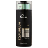 TRUSS Equilibrium conditioner bottle close-up showing hydrating formula for oily scalp