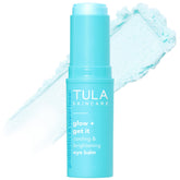 TULA Glow & Get It Eye Balm close-up applying for hydration and brightness.