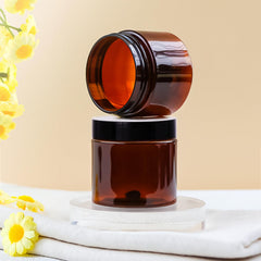 TUZAZO amber 2 oz jar close-up showing secure lid for leakage prevention.