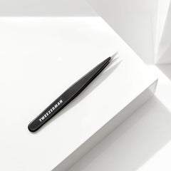 Warm washcloth prep for brows helps ready skin for gentle tweezing.