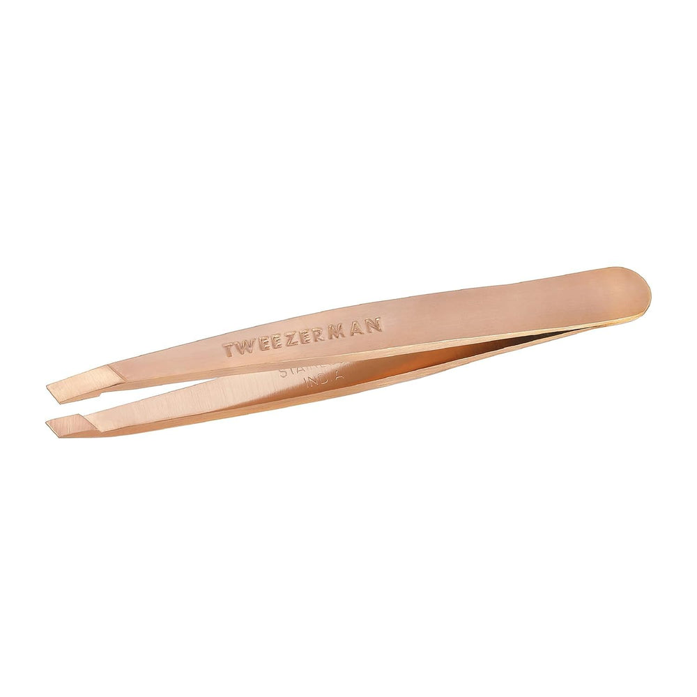 Tweezerman Rose Gold Mini Slant Tweezer closeup shows perfectly aligned tips for precise brow shaping.