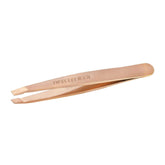 Tweezerman Rose Gold Mini Slant Tweezer closeup shows perfectly aligned tips for precise brow shaping.